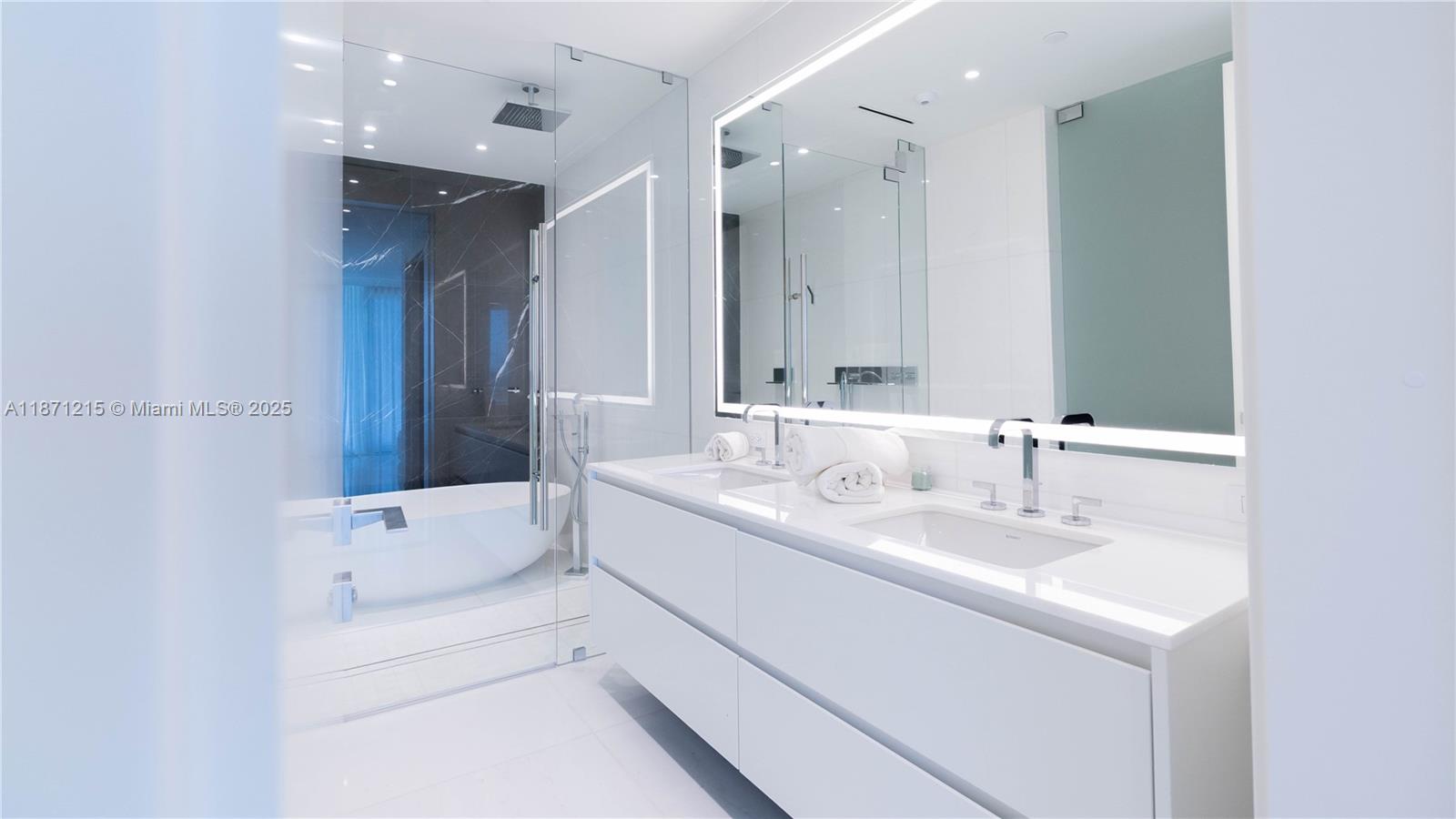 300 Biscayne Blvd Way, Unit 503C Miami, FL 33131 - Photo 23 of 64 a en suite bathroom with a sink and a mirror