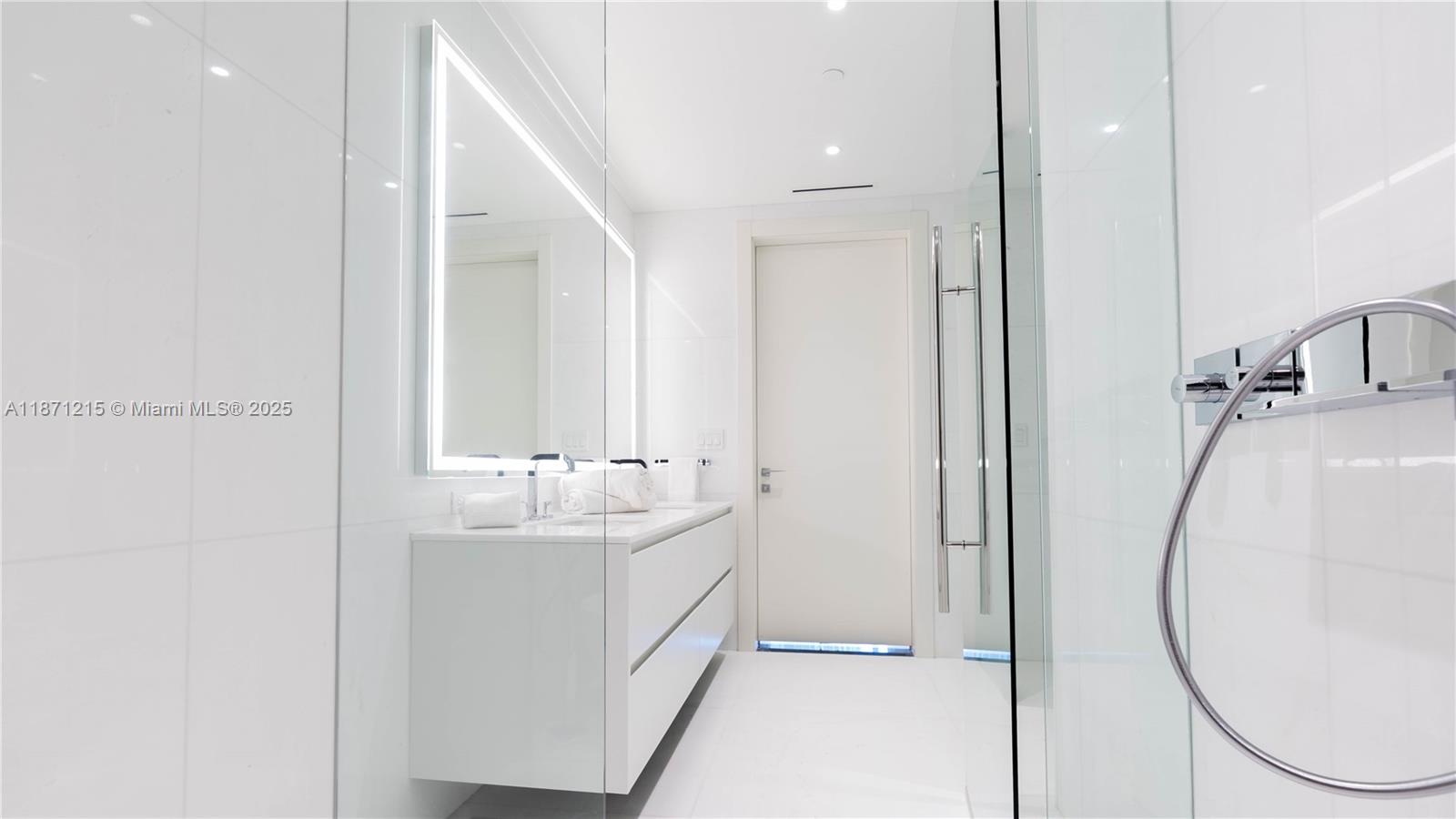 300 Biscayne Blvd Way, Unit 503C Miami, FL 33131 - Photo 25 of 64 a bathroom with a sink and a mirror