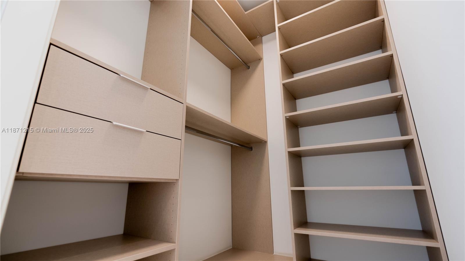 300 Biscayne Blvd Way, Unit 503C Miami, FL 33131 - Photo 34 of 64 a view of walk in closet with empty racks