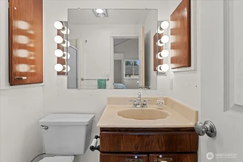 an aerial view of a house with a garden and lake view