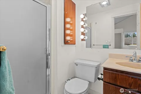 a view of a backyard with a garden and entertaining space