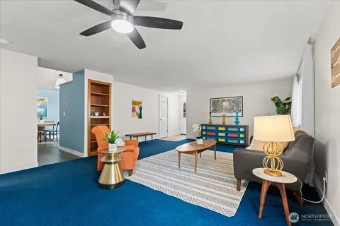 a dining room with furniture and window