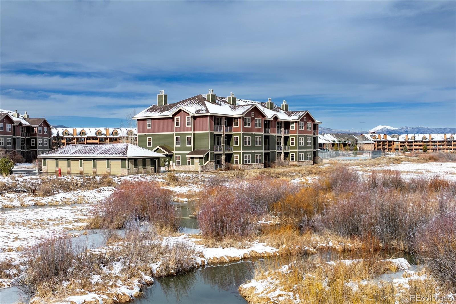 154 Village Road, Unit C103 Granby, CO 80446 - Photo 19 of 39 a view of a lake with a nearby beach
