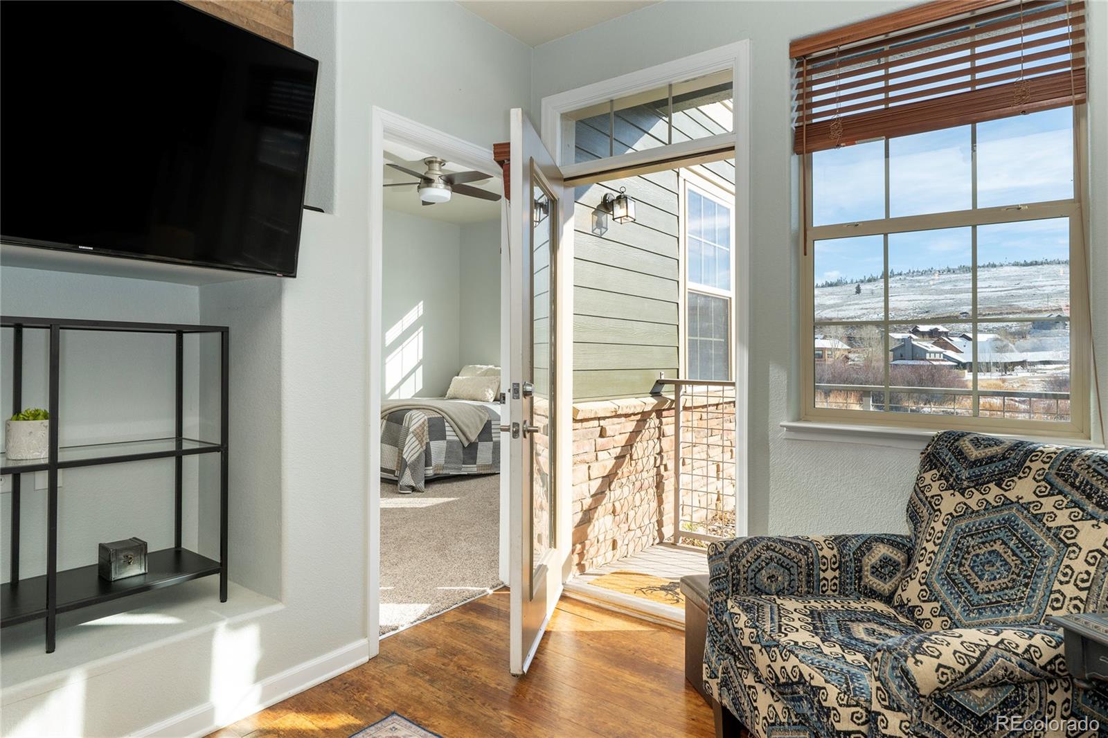 154 Village Road, Unit C103 Granby, CO 80446 - Photo 2 of 39 a bedroom with furniture and a large window