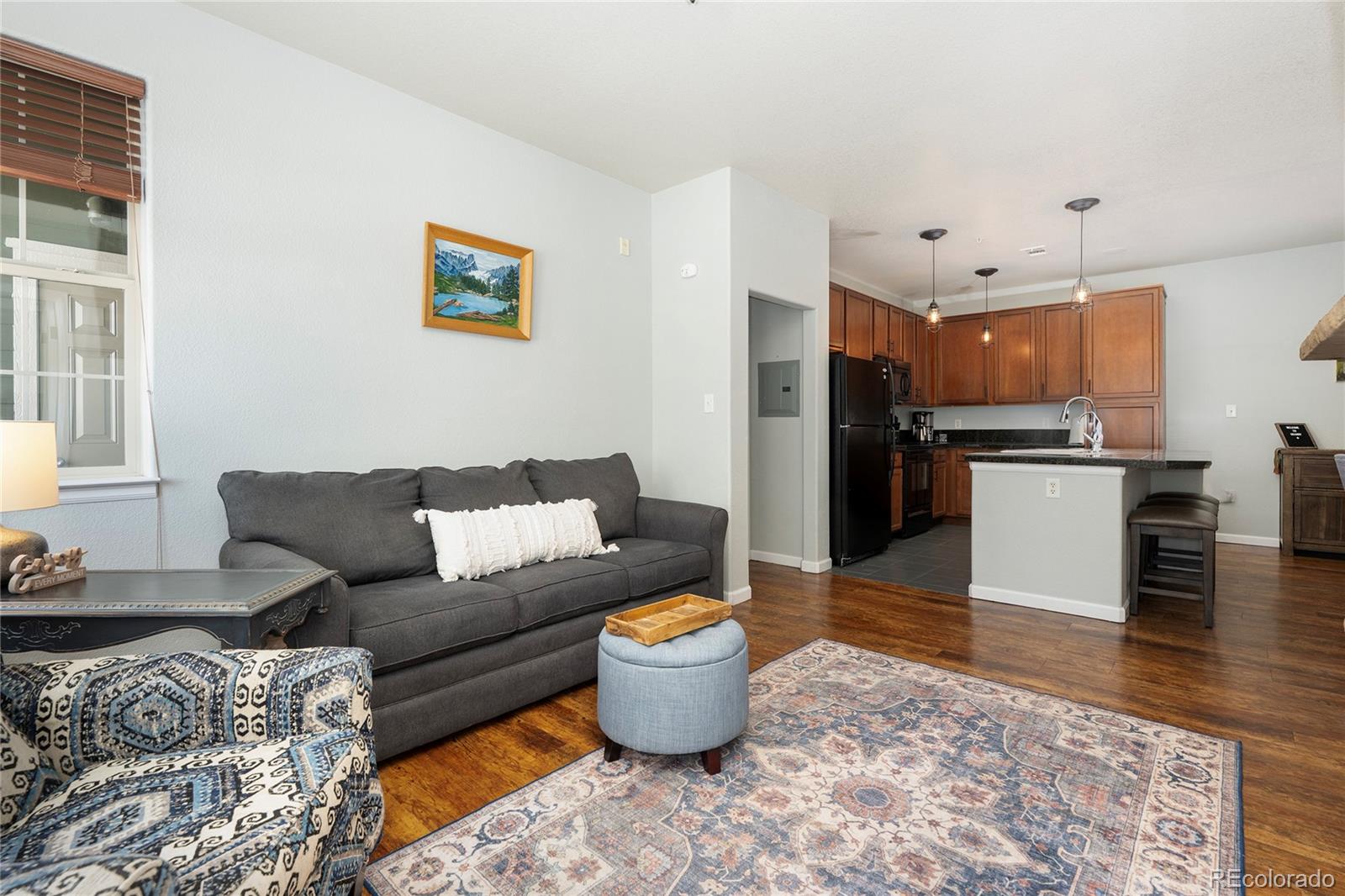 154 Village Road, Unit C103 Granby, CO 80446 - Photo 29 of 39 a living room with stainless steel appliances furniture and a kitchen view