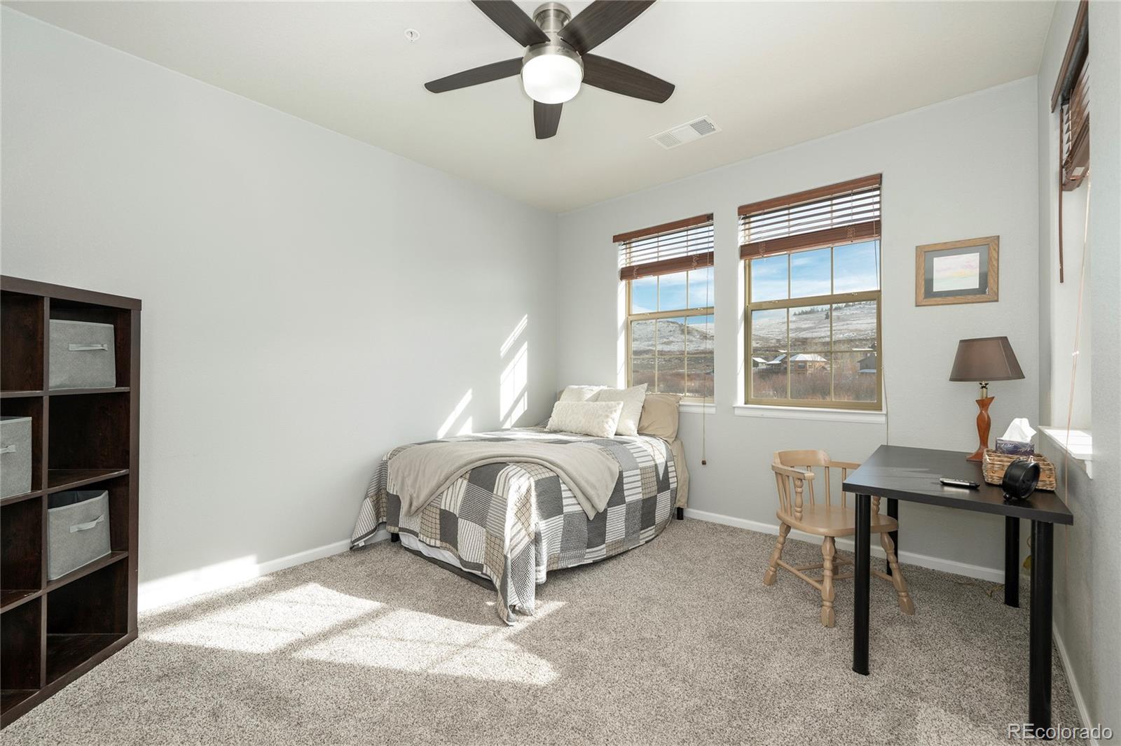 154 Village Road, Unit C103 Granby, CO 80446 - Photo 10 of 39 a spacious bedroom with a bed and a window
