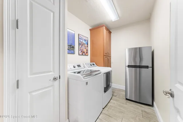 a bedroom with a bed and a chair