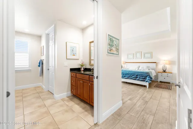 a view of a balcony with wooden floor and fence