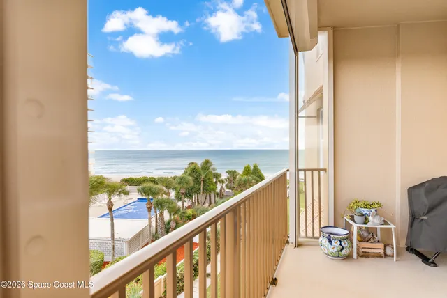 a living room with furniture a rug and a large window