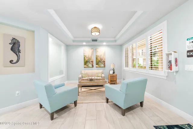 a view of a room with a ceiling fan