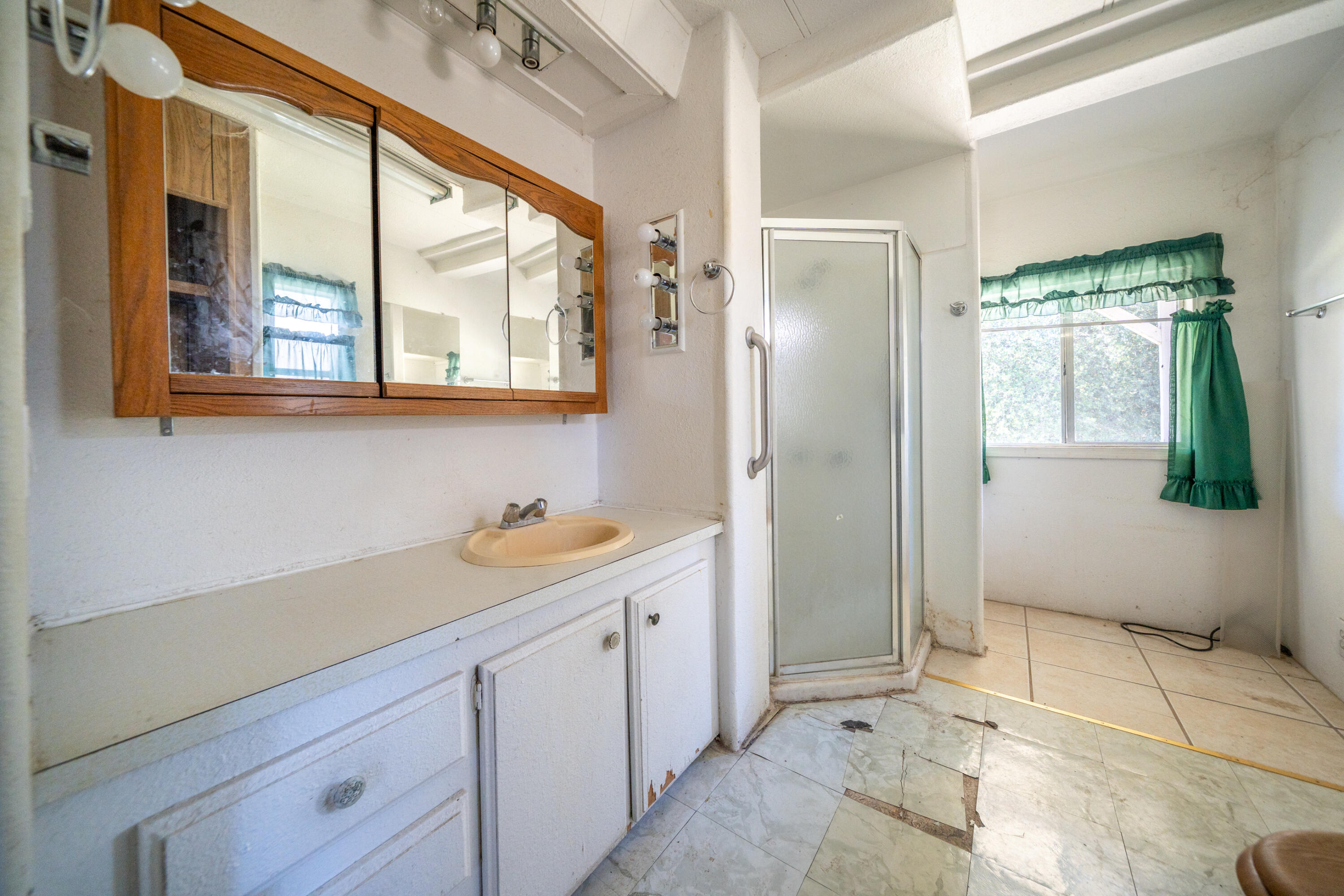 18355 Benson Road Cottonwood, CA 96022 - Photo 11 of 18 a bathroom with a sink and a mirror