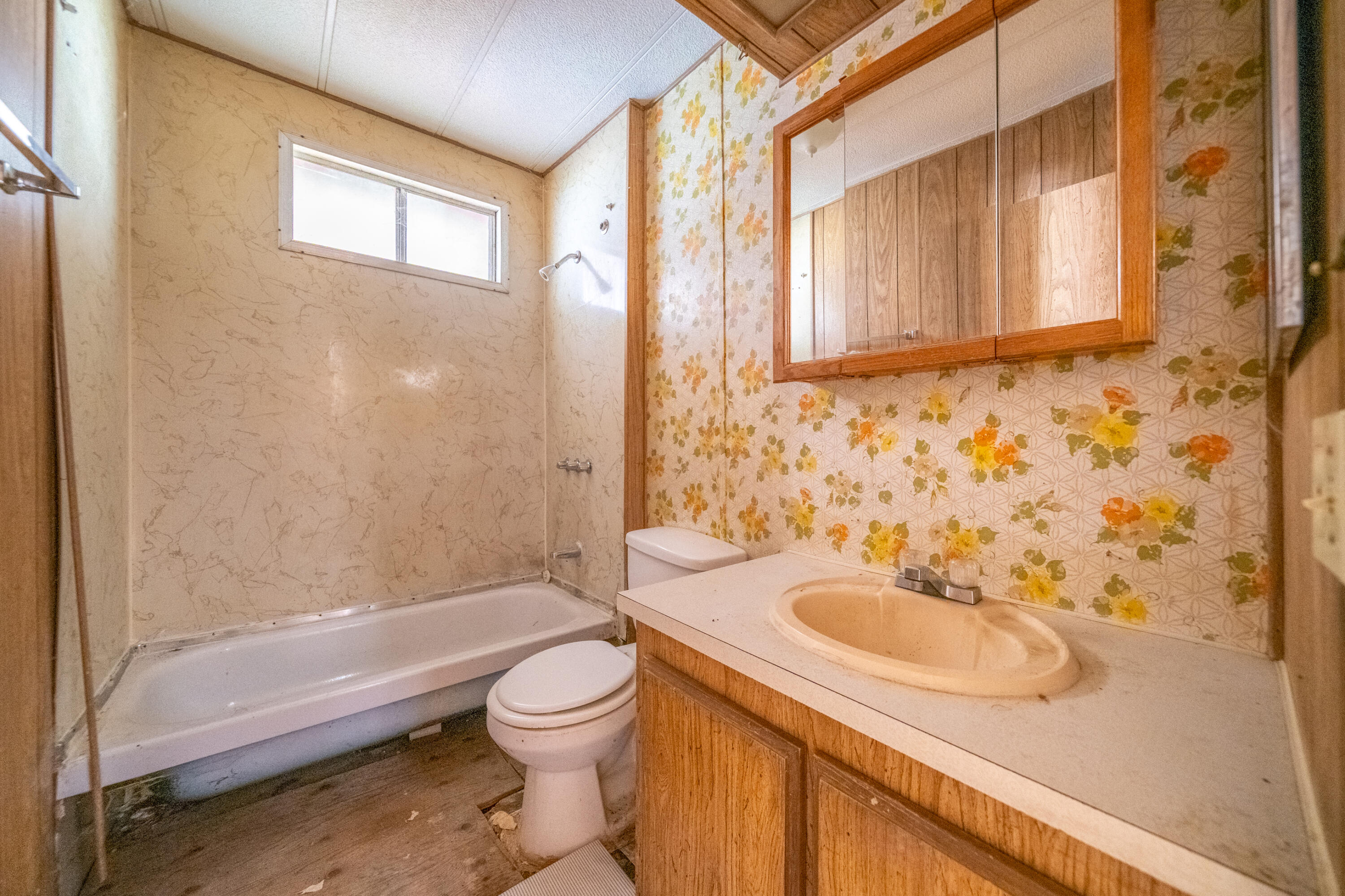 18355 Benson Road Cottonwood, CA 96022 - Photo 12 of 18 a bathroom with a sink a toilet and a bathtub