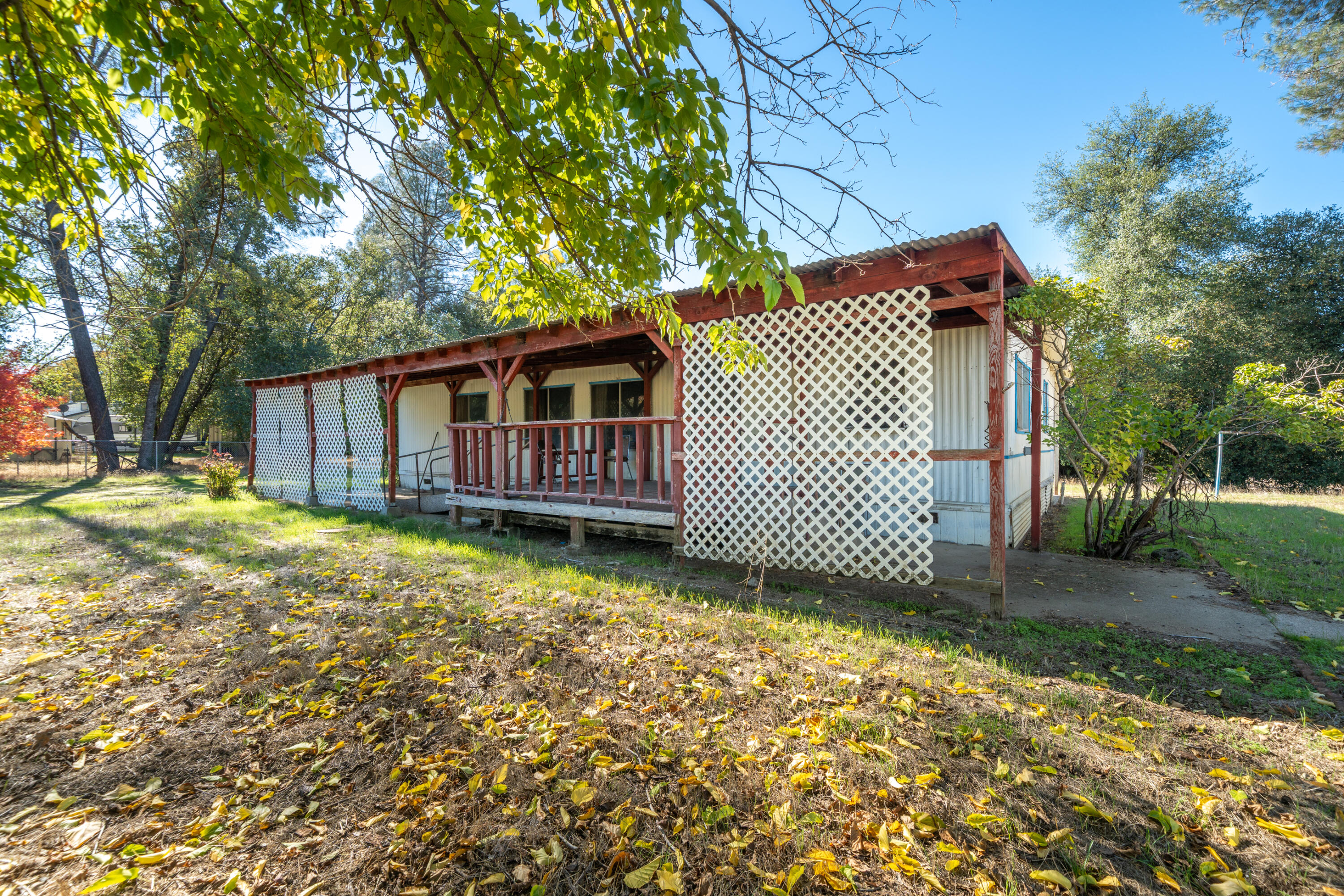 18355 Benson Road Cottonwood, CA 96022 - Photo 2 of 18 a view of a house with a yard