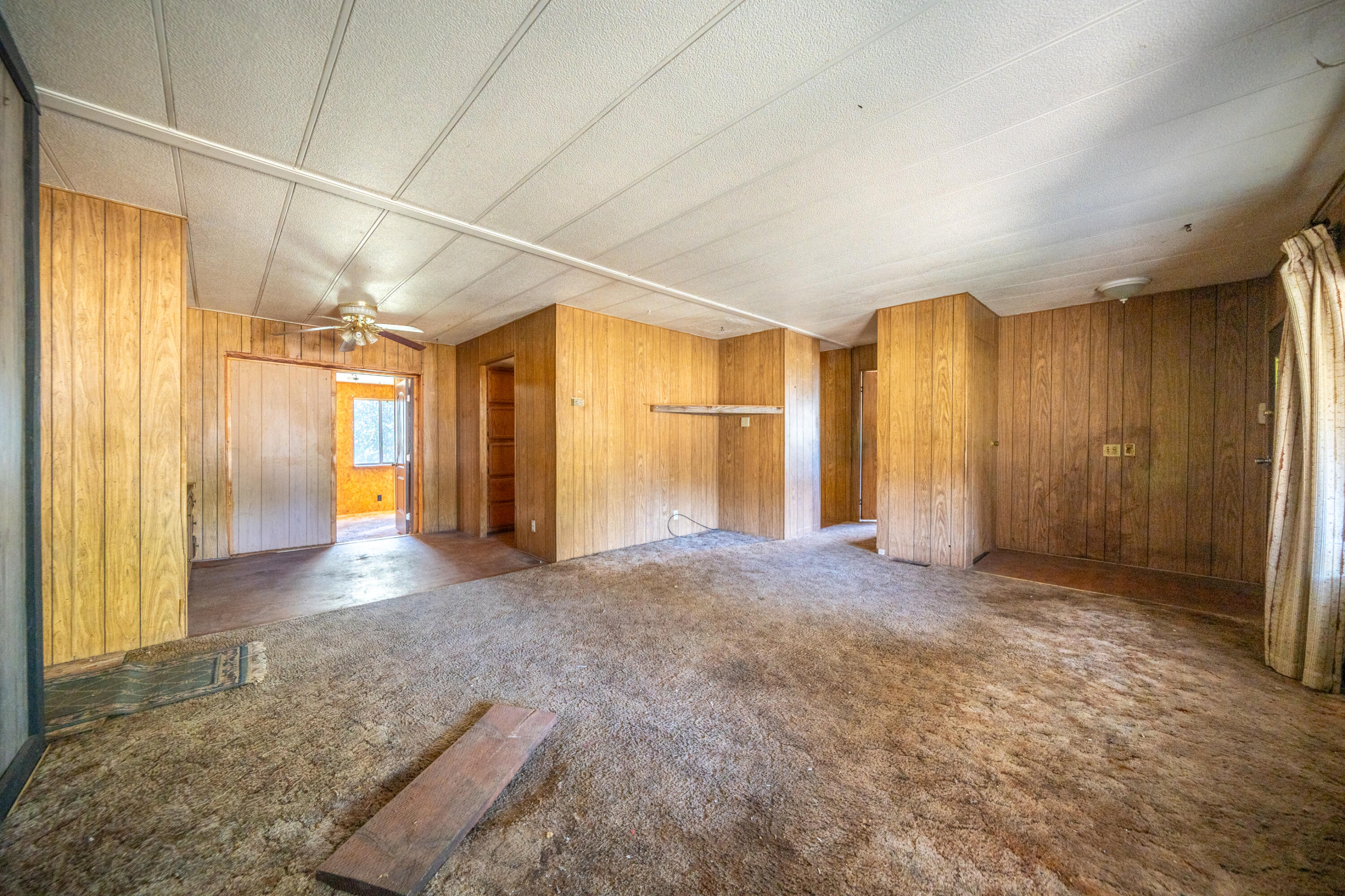 18355 Benson Road Cottonwood, CA 96022 - Photo 4 of 18 a view of empty room with wooden floor and entryway