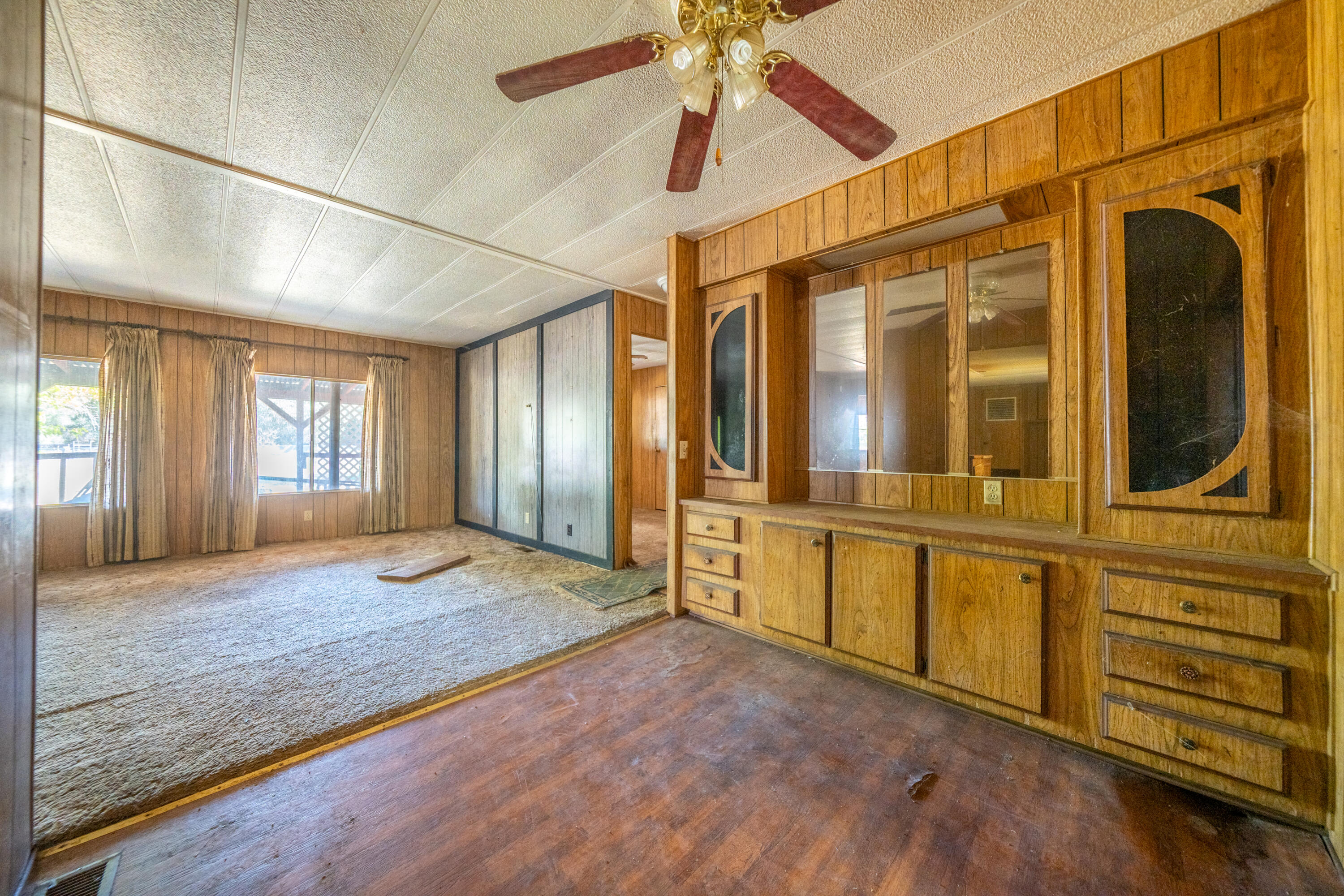 18355 Benson Road Cottonwood, CA 96022 - Photo 6 of 18 a view of an empty room with window and cabinet