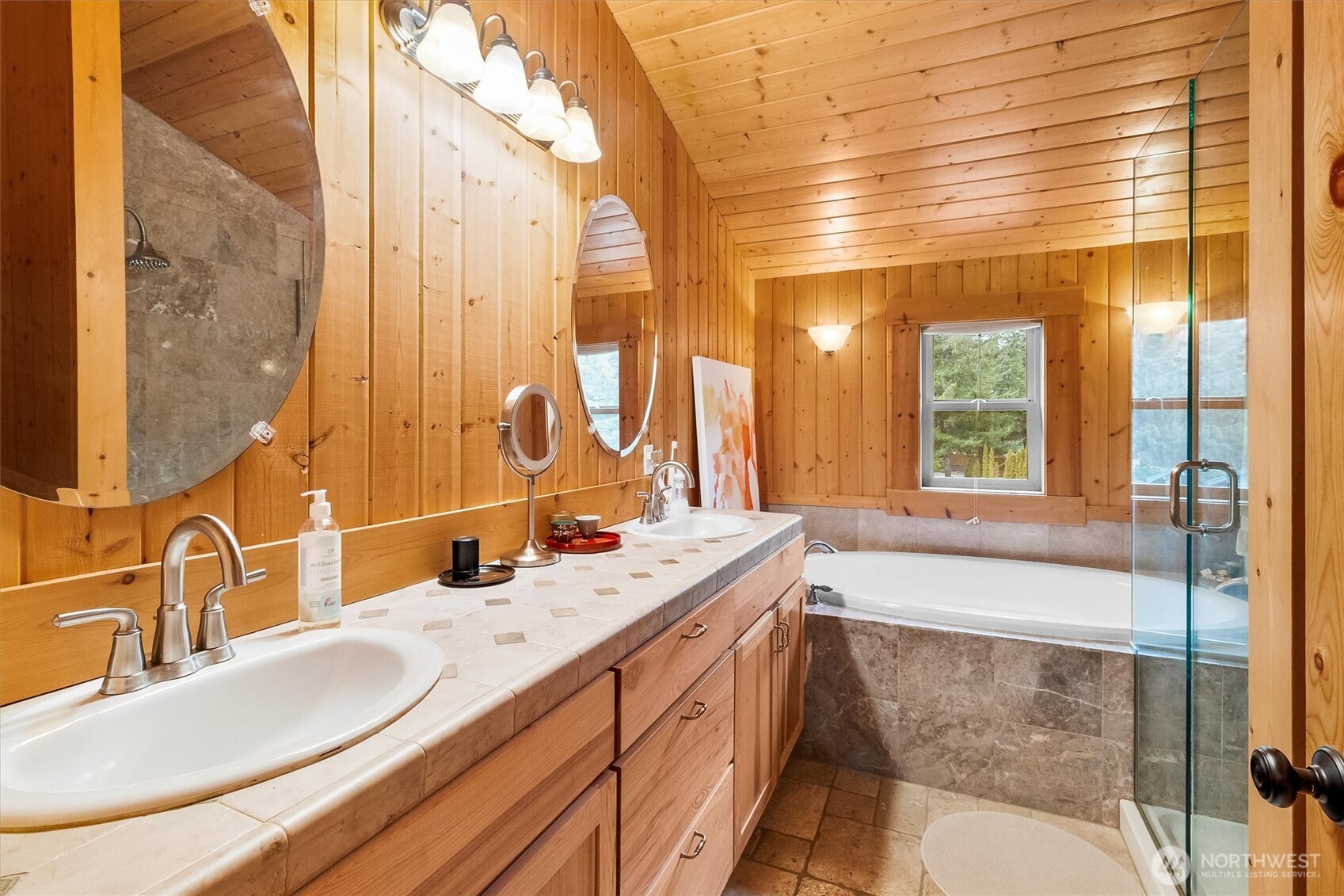 19040 Glacier Rim Drive Glacier, WA 98244 - Photo 20 of 40 a bathroom with a sink and a large mirror