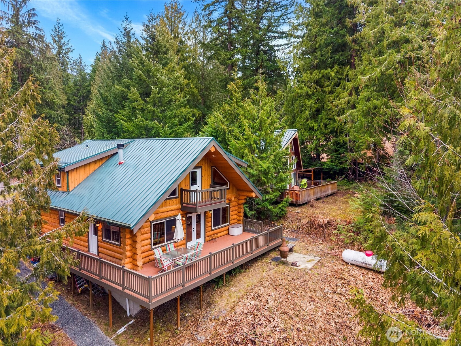 19040 Glacier Rim Drive Glacier, WA 98244 - Photo 29 of 40 an aerial view of a house with balcony wooden fence and trees