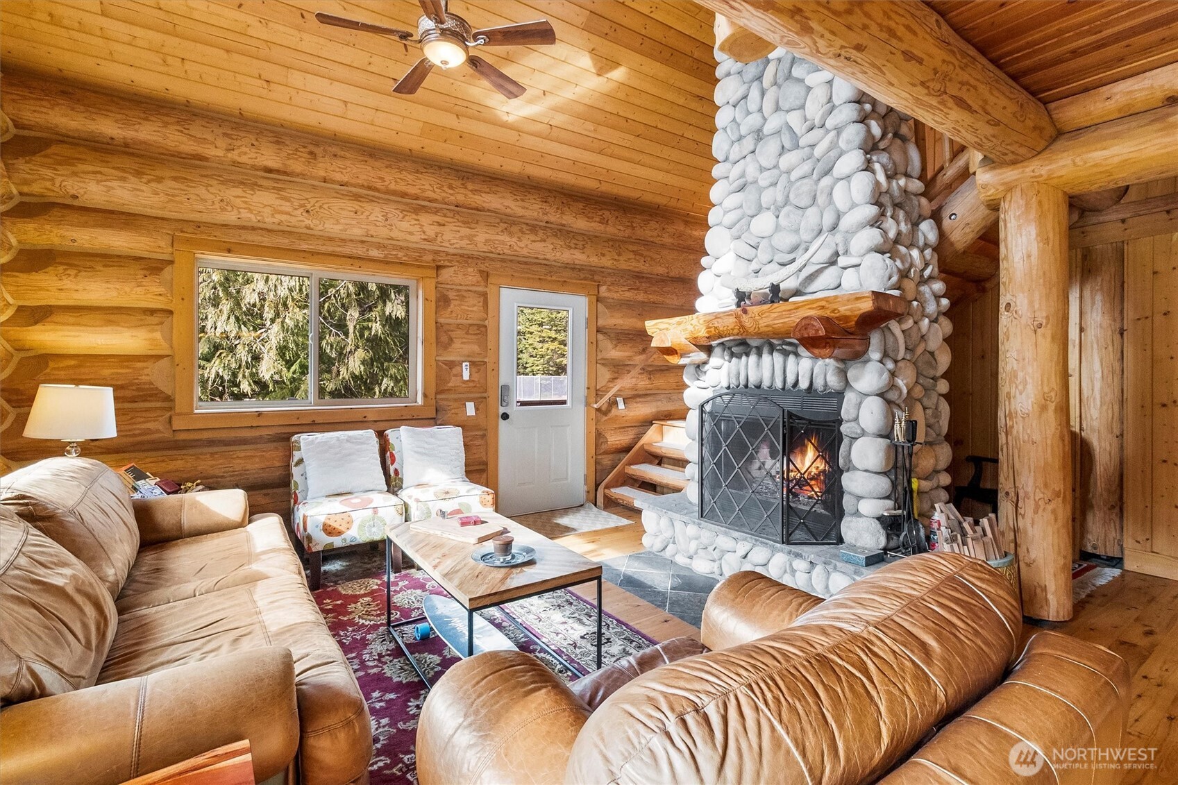 19040 Glacier Rim Drive Glacier, WA 98244 - Photo 10 of 40 a living room with furniture and a fireplace