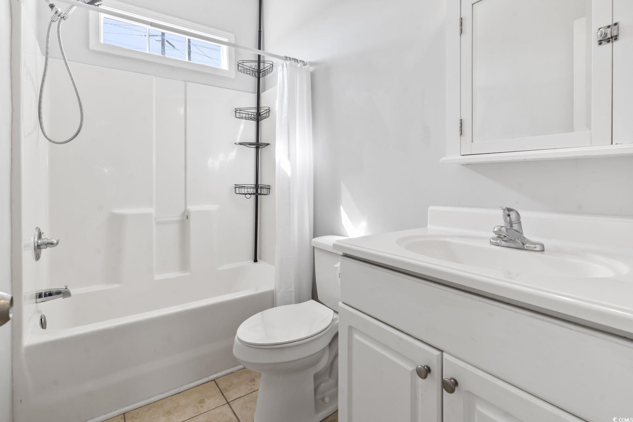 191 Addison Cottage Way Murrells Inlet, SC 29576 - Photo 16 of 28 Full bath with shower / tub combo with curtain, light tile patterned floors, and vanity