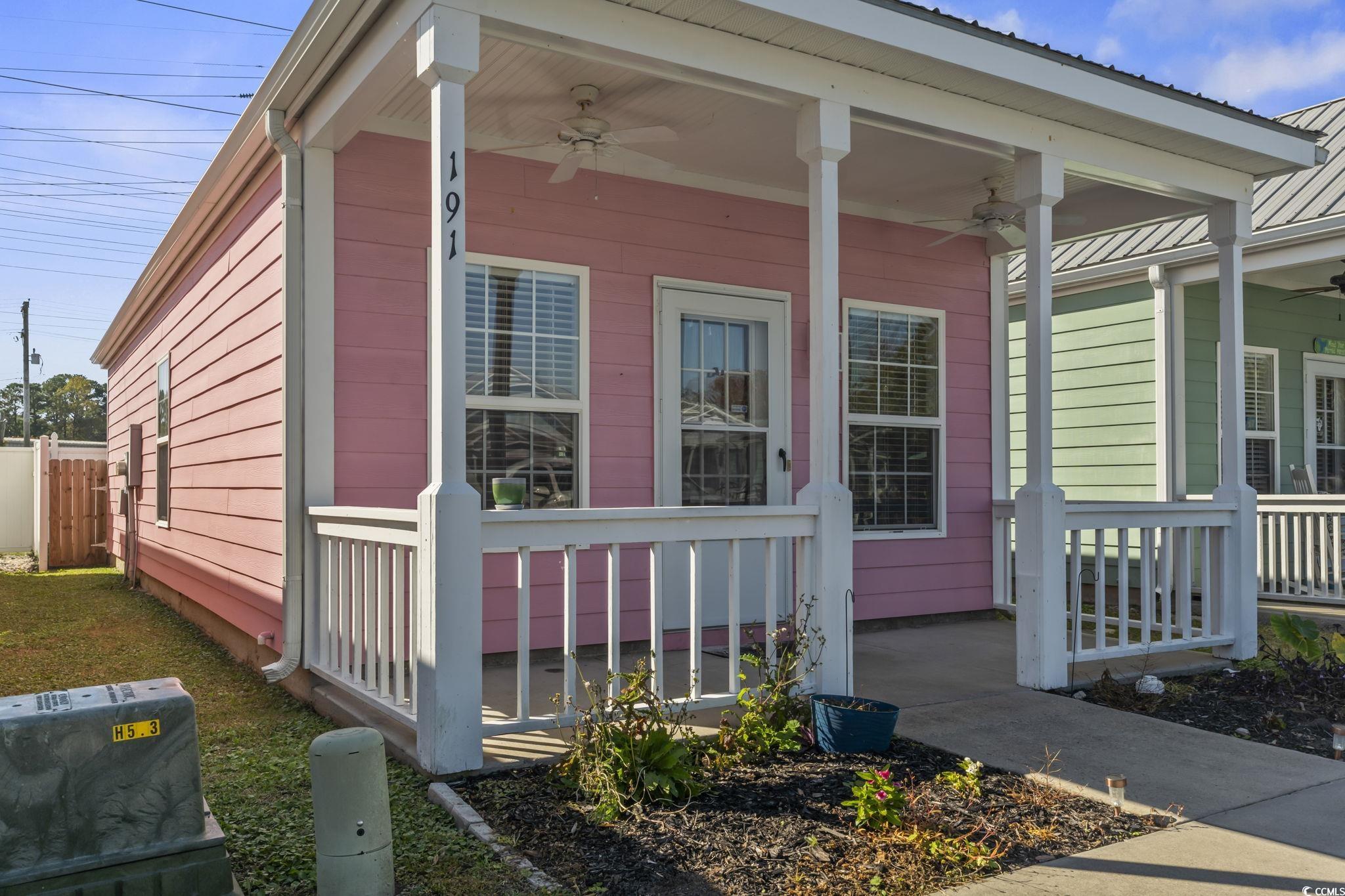 191 Addison Cottage Way Murrells Inlet, SC 29576 - Photo 26 of 28 View of side of property with a porch, a ceiling fan, and a metal roof