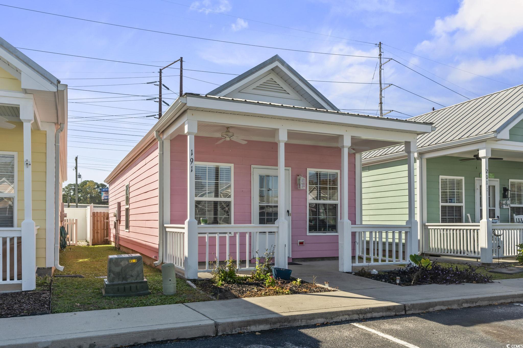 191 Addison Cottage Way Murrells Inlet, SC 29576 - Photo 27 of 28 Shotgun-style home with a ceiling fan and a porch
