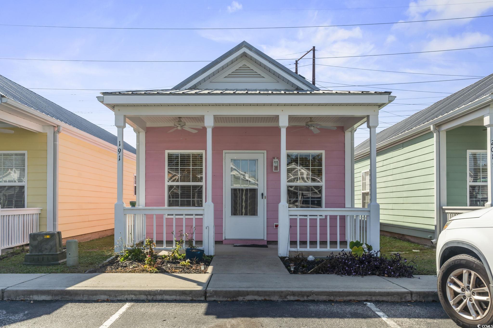 191 Addison Cottage Way Murrells Inlet, SC 29576 - Photo 28 of 28 Shotgun-style home with a ceiling fan, a porch, and a metal roof