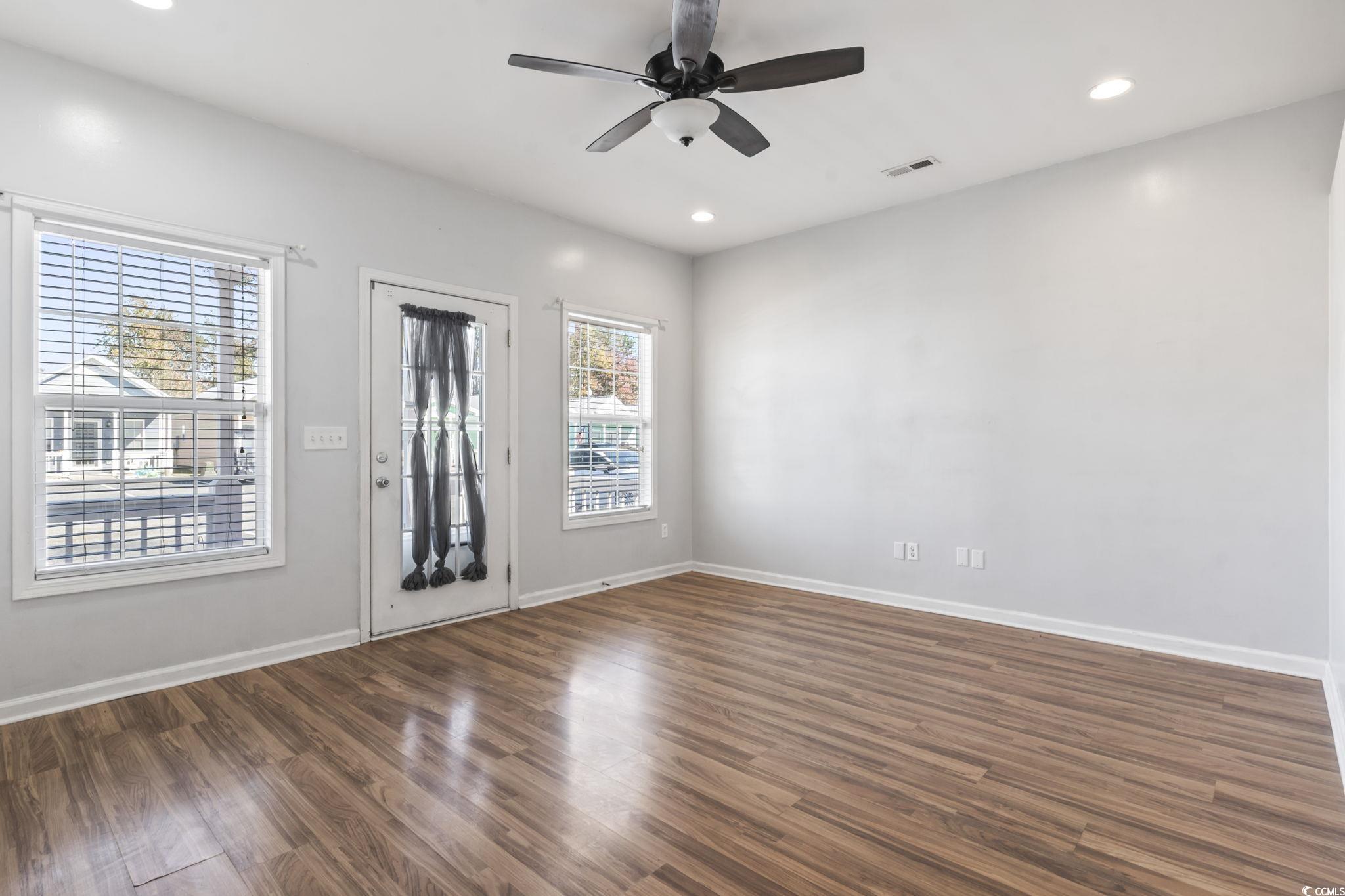 191 Addison Cottage Way Murrells Inlet, SC 29576 - Photo 8 of 28 Spare room with dark wood-style floors, recessed lighting, and ceiling fan