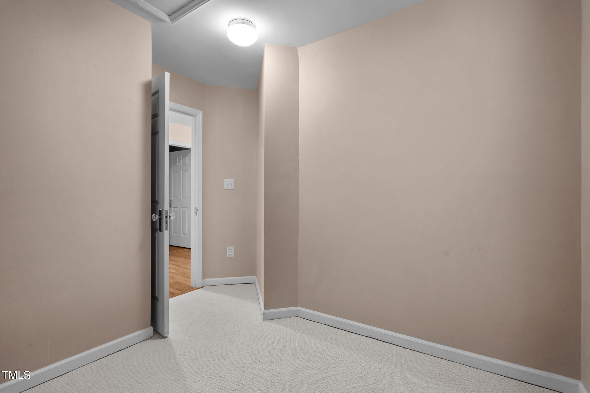 8241 Hempshire Place, Unit 102 Raleigh, NC 27613 - Photo 23 of 30 a view of an empty room