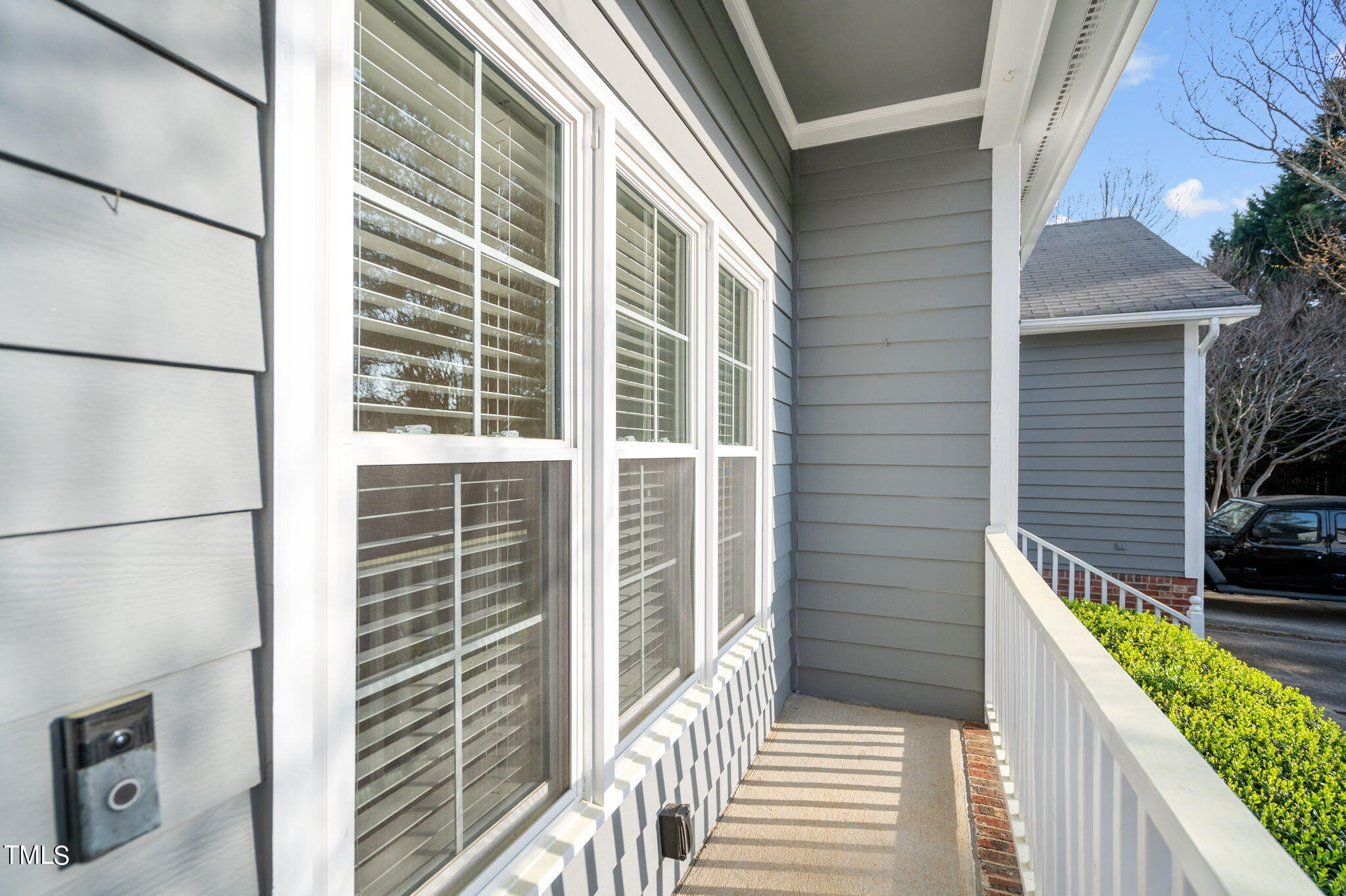 8241 Hempshire Place, Unit 102 Raleigh, NC 27613 - Photo 26 of 30 a view of a balcony with wooden floor and fence