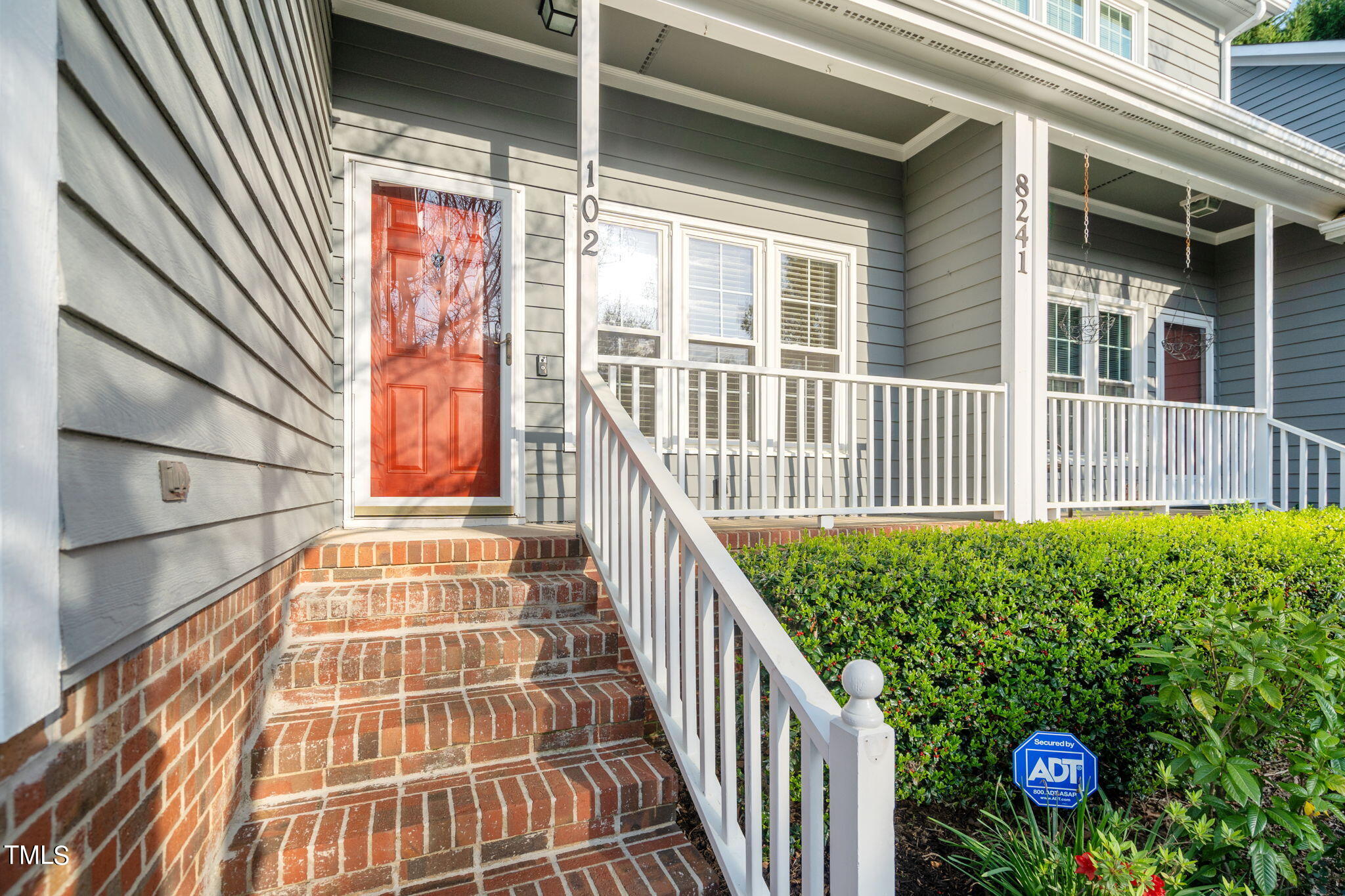 8241 Hempshire Place, Unit 102 Raleigh, NC 27613 - Photo 4 of 30 a view of a balcony with door
