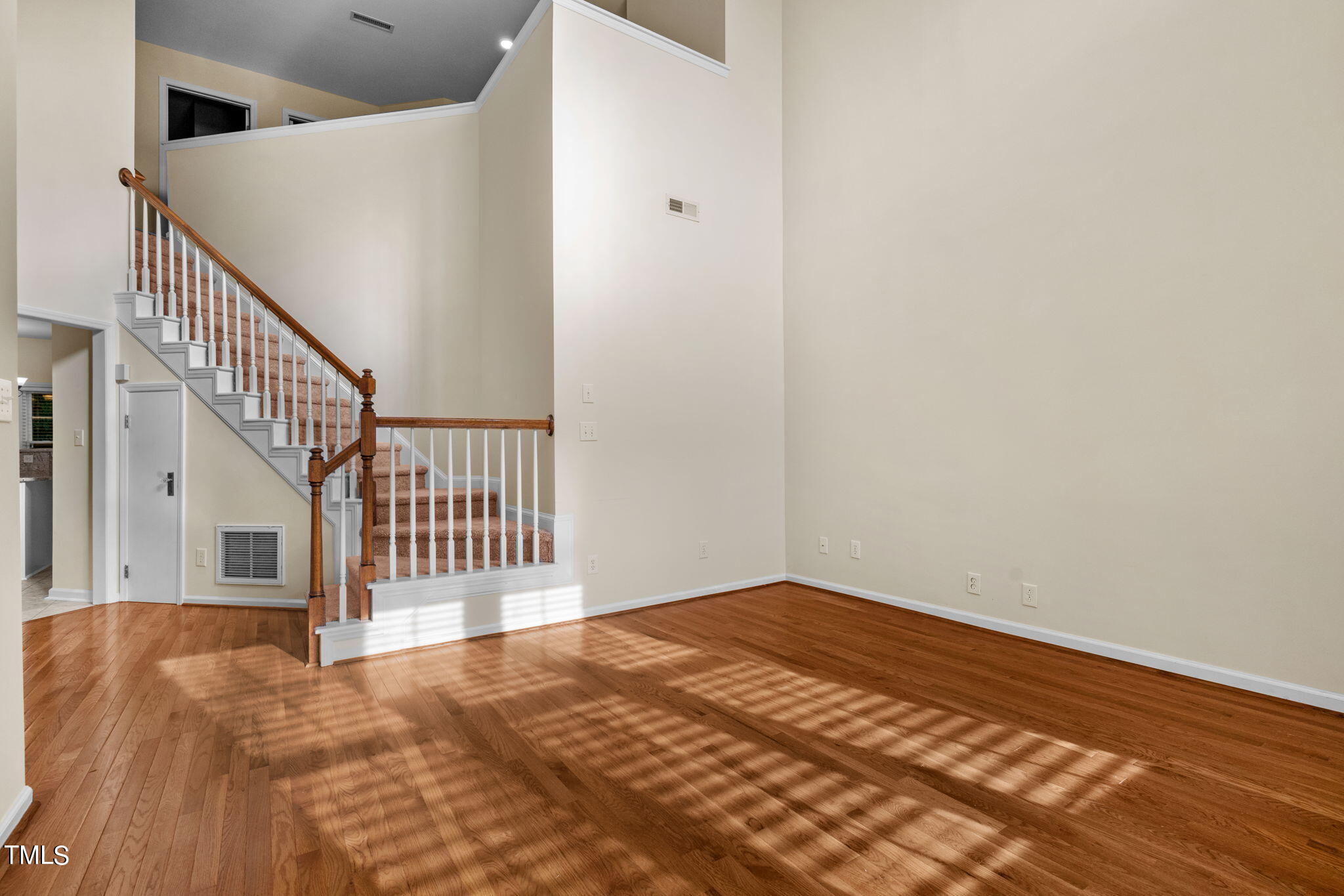 8241 Hempshire Place, Unit 102 Raleigh, NC 27613 - Photo 6 of 30 a view of a hallway with staircase