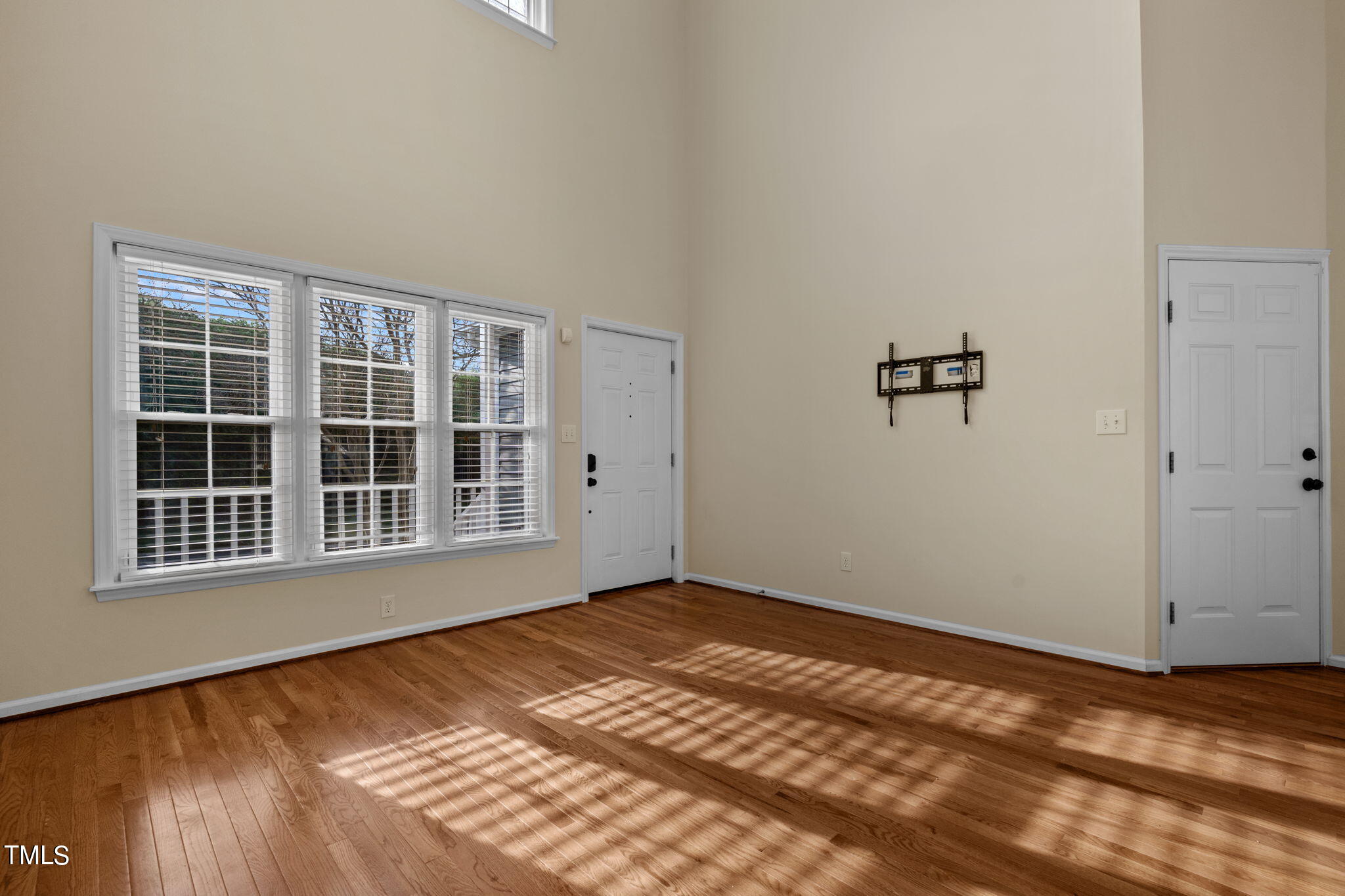 8241 Hempshire Place, Unit 102 Raleigh, NC 27613 - Photo 8 of 30 a view of an empty room with a window