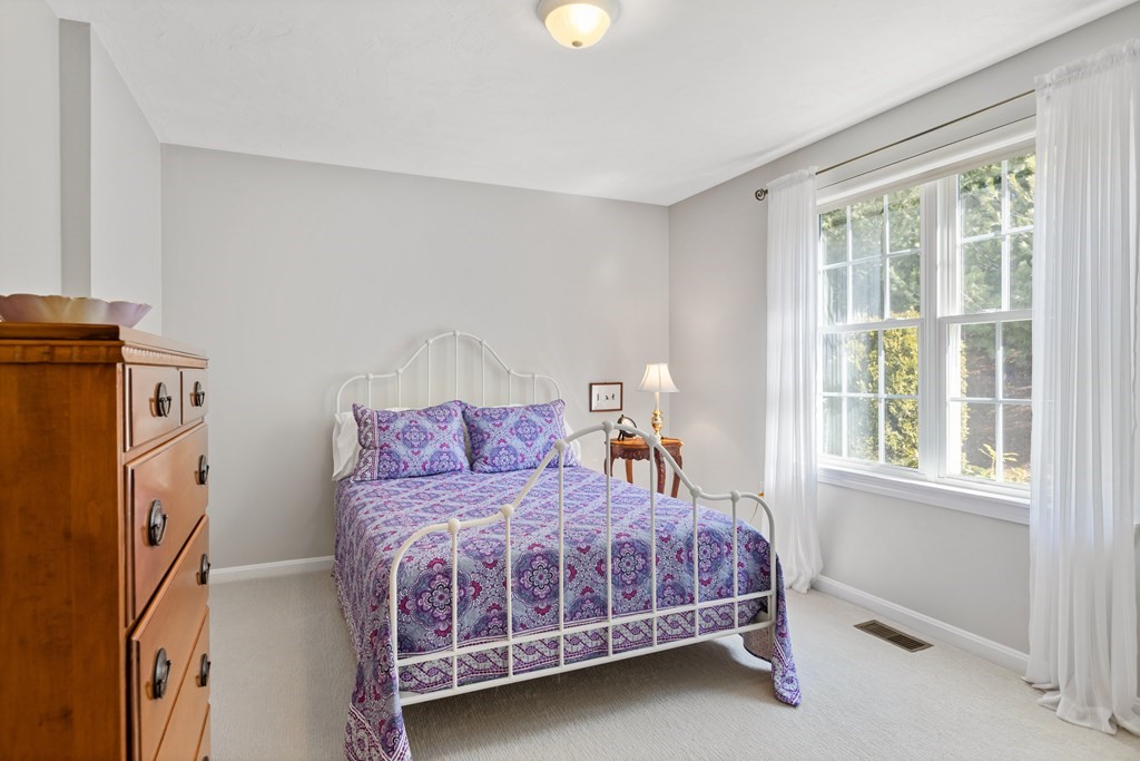 17 D Cold Spring Drive, Unit D Sutton, MA 01590 - Photo 14 of 20 a bed room with a bed and a window