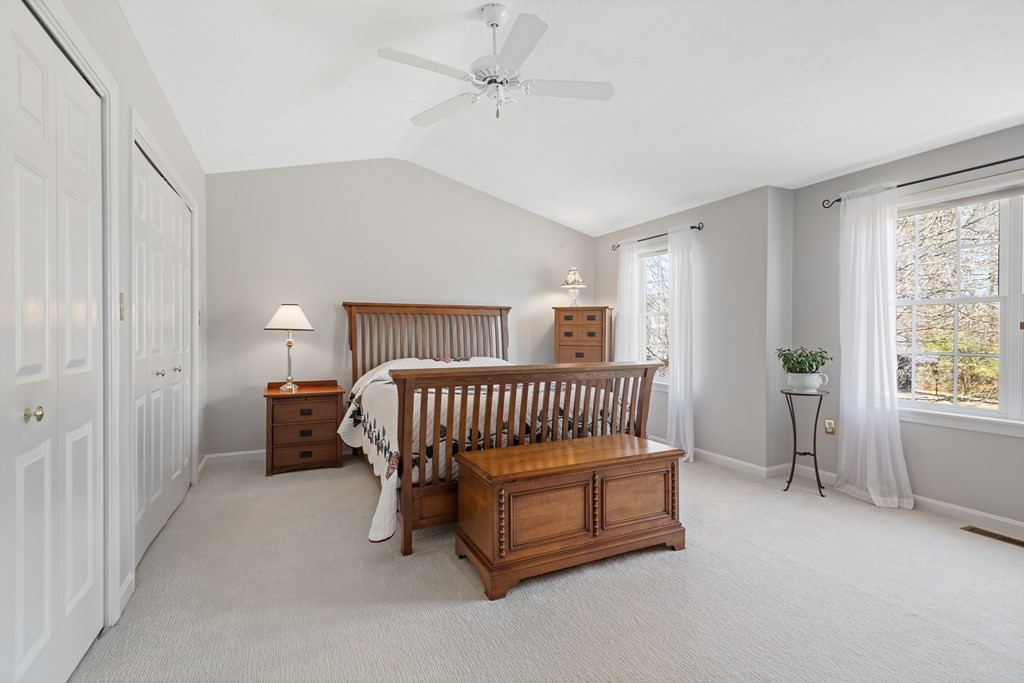 17 D Cold Spring Drive, Unit D Sutton, MA 01590 - Photo 16 of 20 a bedroom with a bed and a window
