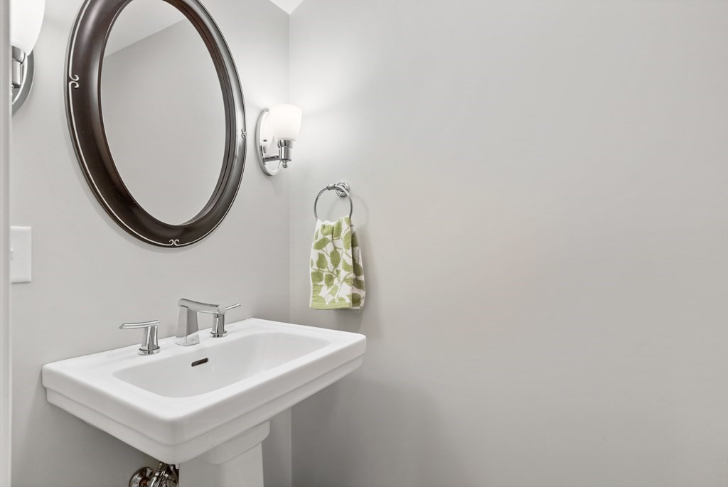 17 D Cold Spring Drive, Unit D Sutton, MA 01590 - Photo 17 of 20 a bathroom with a sink and a mirror