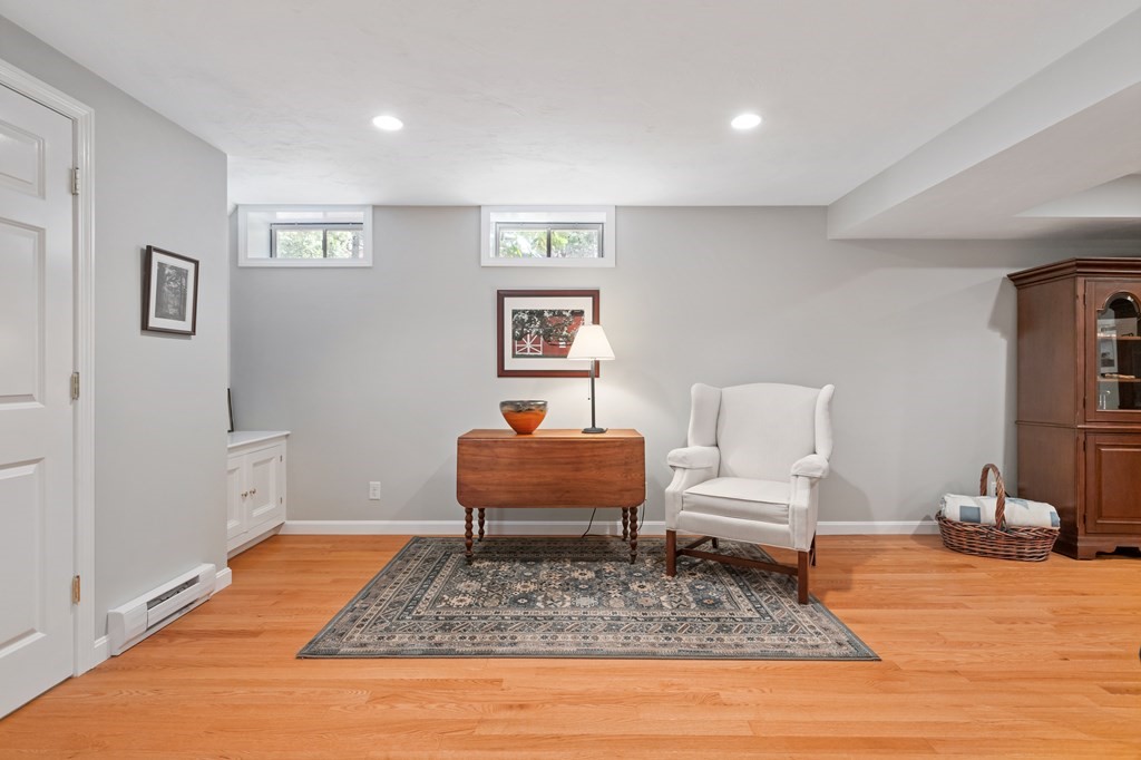 17 D Cold Spring Drive, Unit D Sutton, MA 01590 - Photo 18 of 20 a living room with furniture and a rug