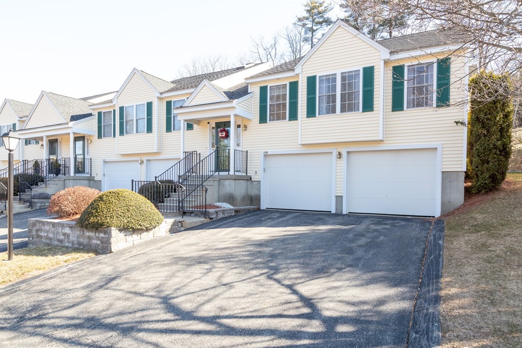 17 D Cold Spring Drive, Unit D Sutton, MA 01590 - Photo 2 of 20 a front view of a house with a yard