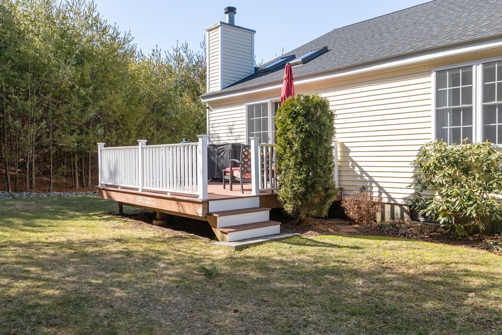 17 D Cold Spring Drive, Unit D Sutton, MA 01590 - Photo 4 of 20 a view of a house with a yard and sitting area