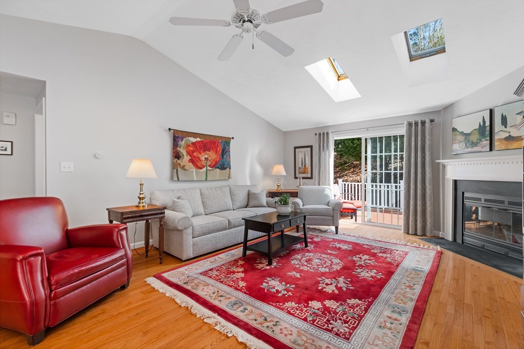 17 D Cold Spring Drive, Unit D Sutton, MA 01590 - Photo 6 of 20 a living room with furniture a rug and a fireplace