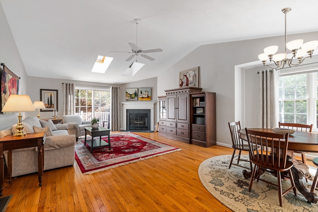 17 D Cold Spring Drive, Unit D Sutton, MA 01590 - Photo 8 of 20 a living room with furniture and a fireplace