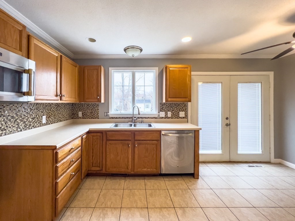 125 Hood Street Springfield, MA 01109 - Photo 5 of 17 a large kitchen with stainless steel appliances granite countertop a sink and cabinets