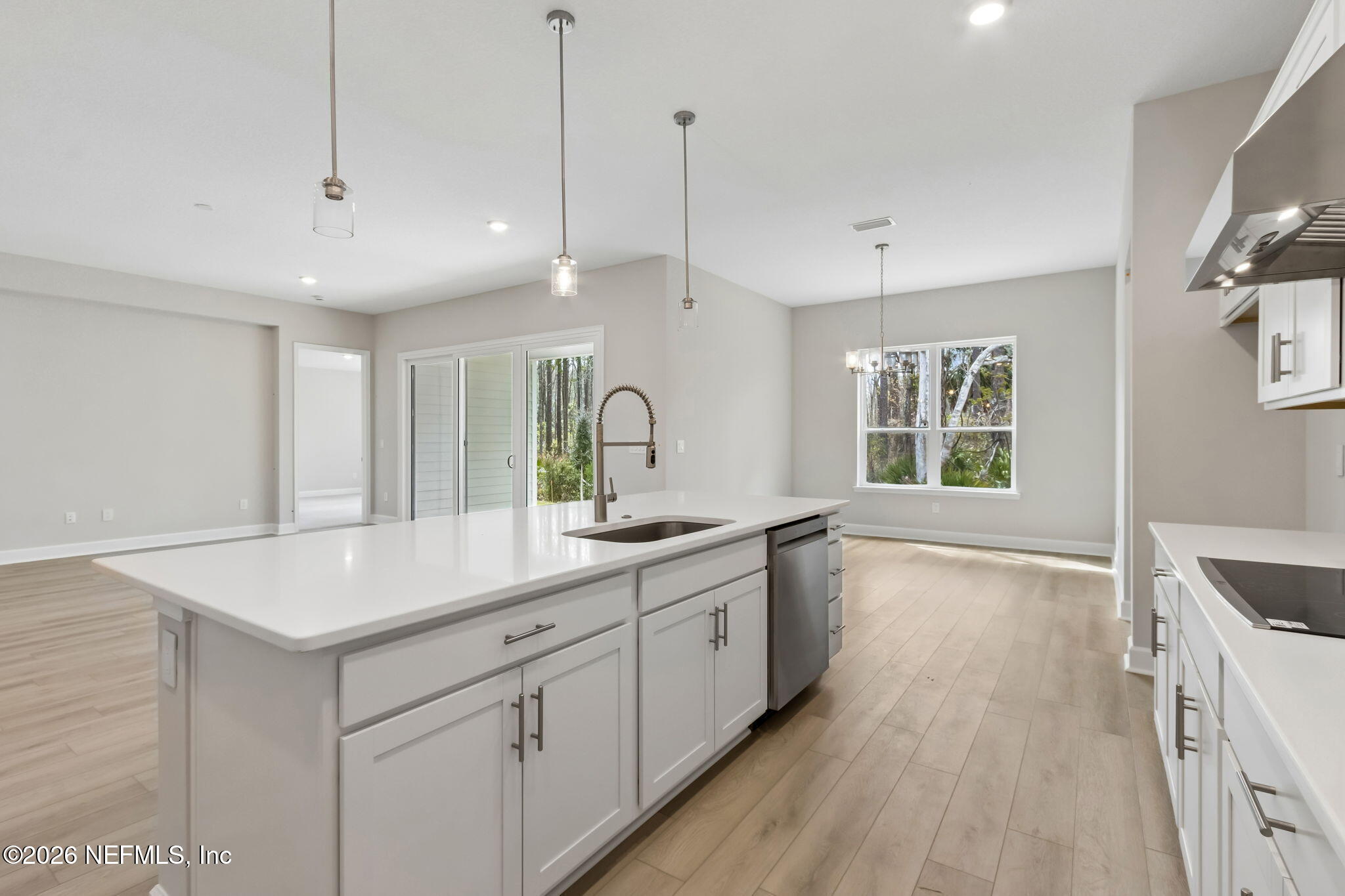 85350 Sandy Rdg Loop, Unit 39 Yulee, FL 32097 - Photo 11 of 29 a kitchen with white cabinets and sink