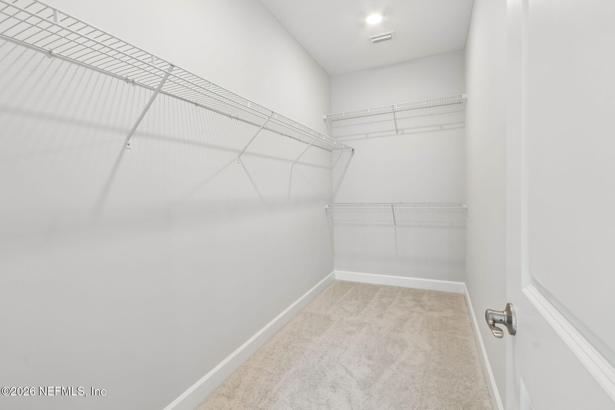 85350 Sandy Rdg Loop, Unit 39 Yulee, FL 32097 - Photo 17 of 29 a view of a room with racks on the wall
