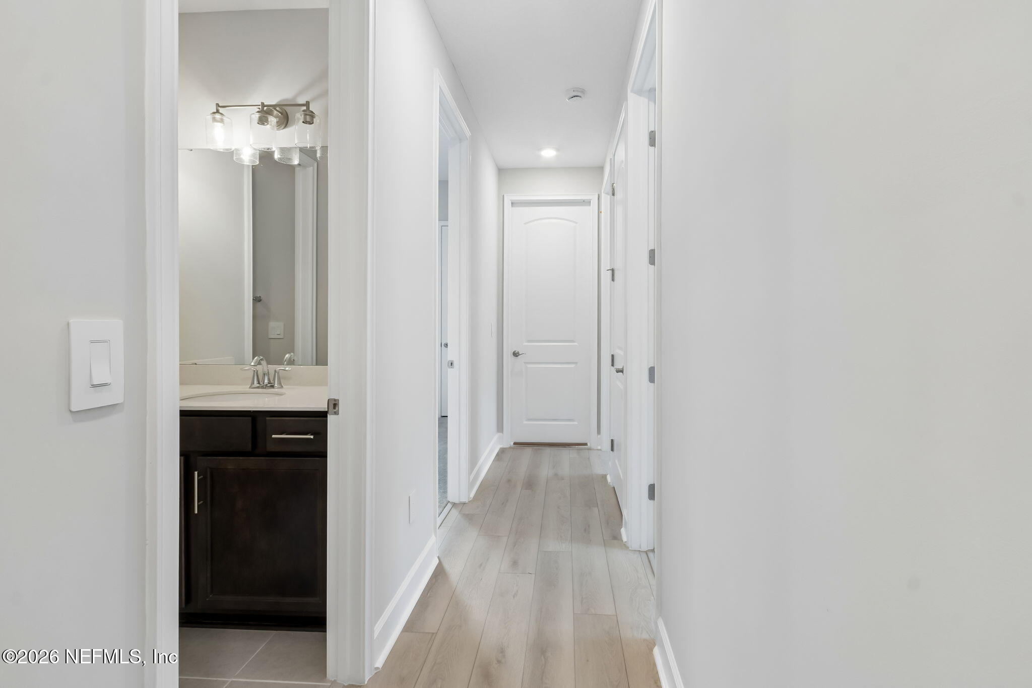85350 Sandy Rdg Loop, Unit 39 Yulee, FL 32097 - Photo 18 of 29 a view of a hallway with wooden floor