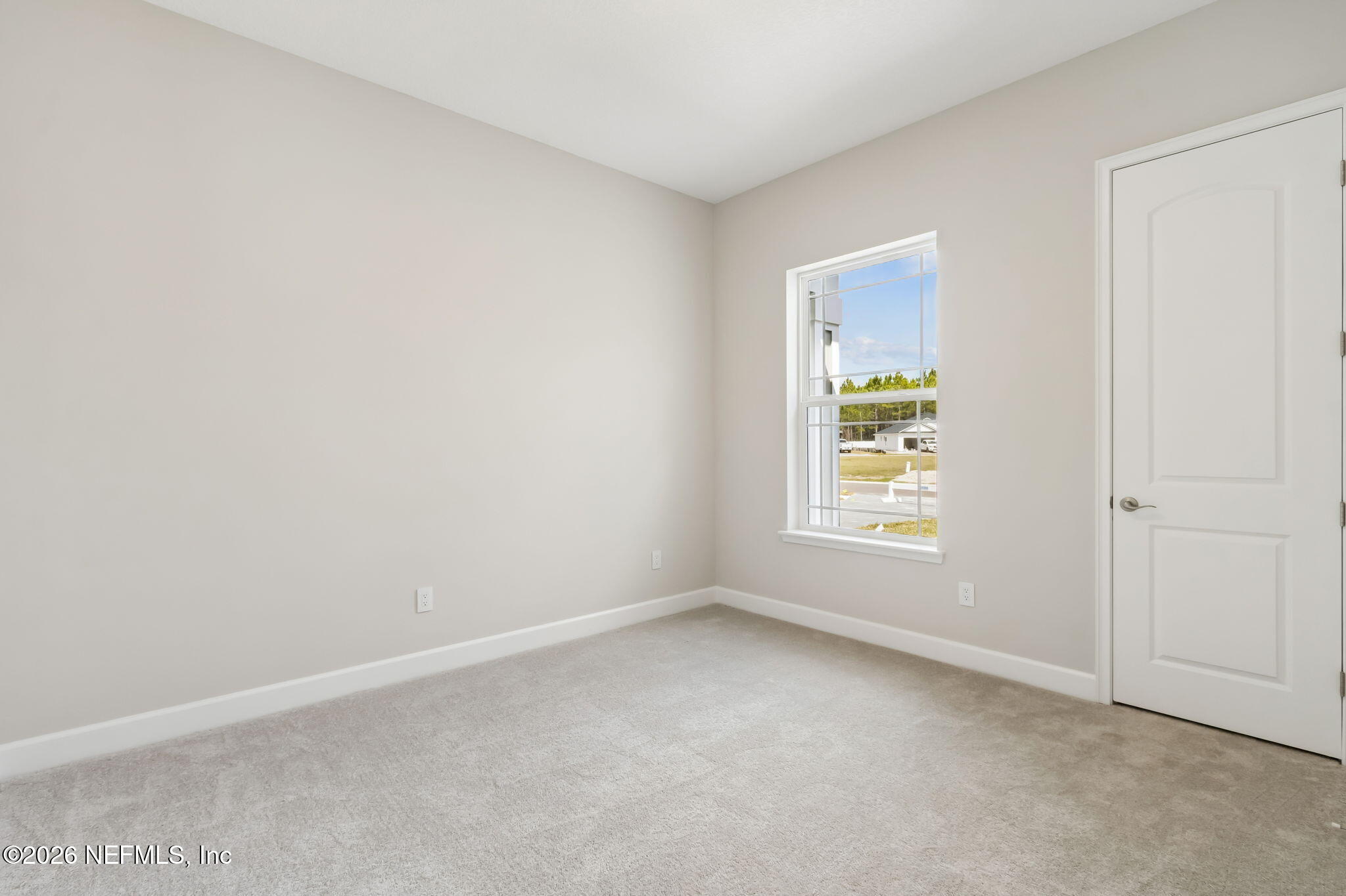 85350 Sandy Rdg Loop, Unit 39 Yulee, FL 32097 - Photo 21 of 29 an empty room with a window