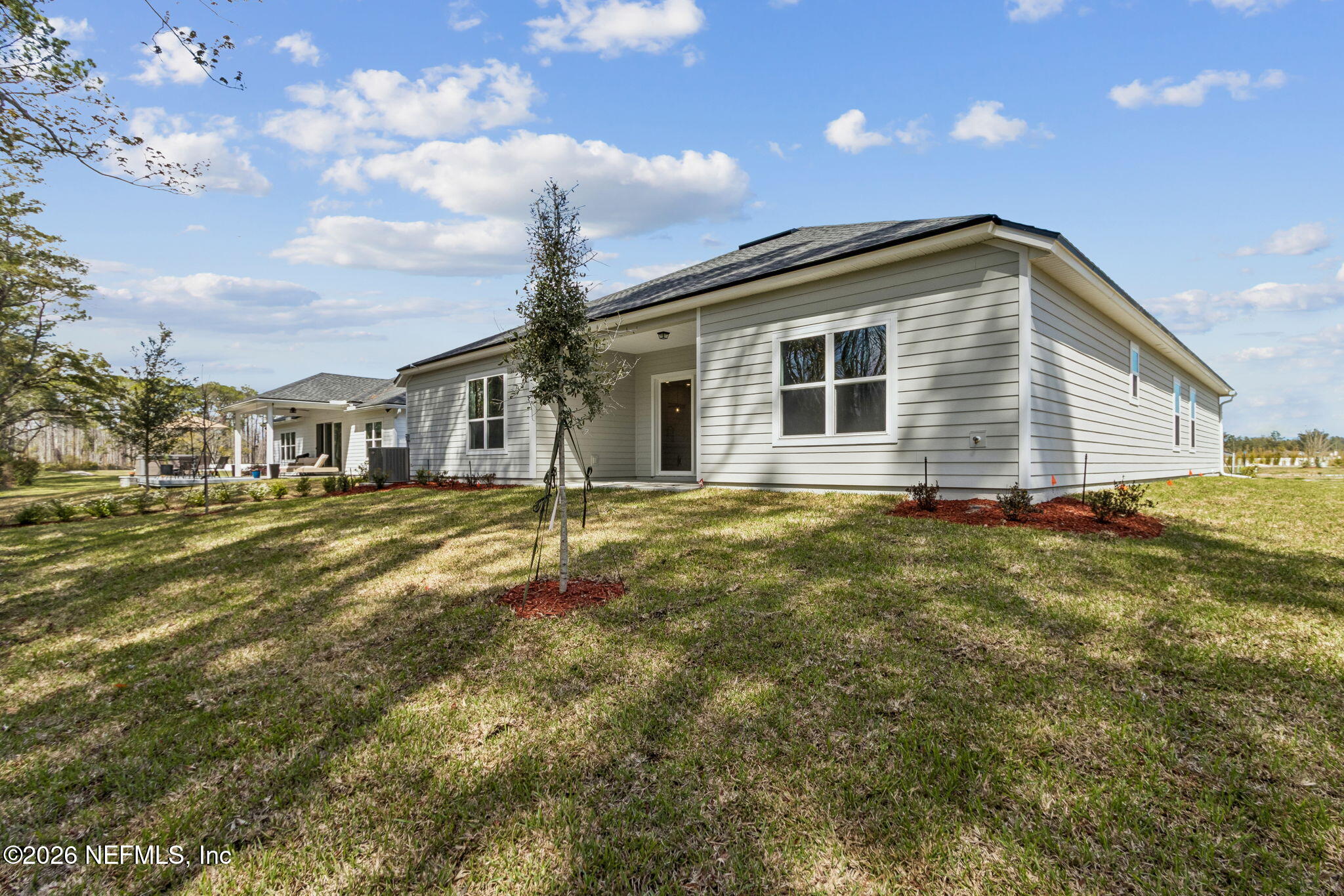 85350 Sandy Rdg Loop, Unit 39 Yulee, FL 32097 - Photo 26 of 29 a view of a house with a backyard
