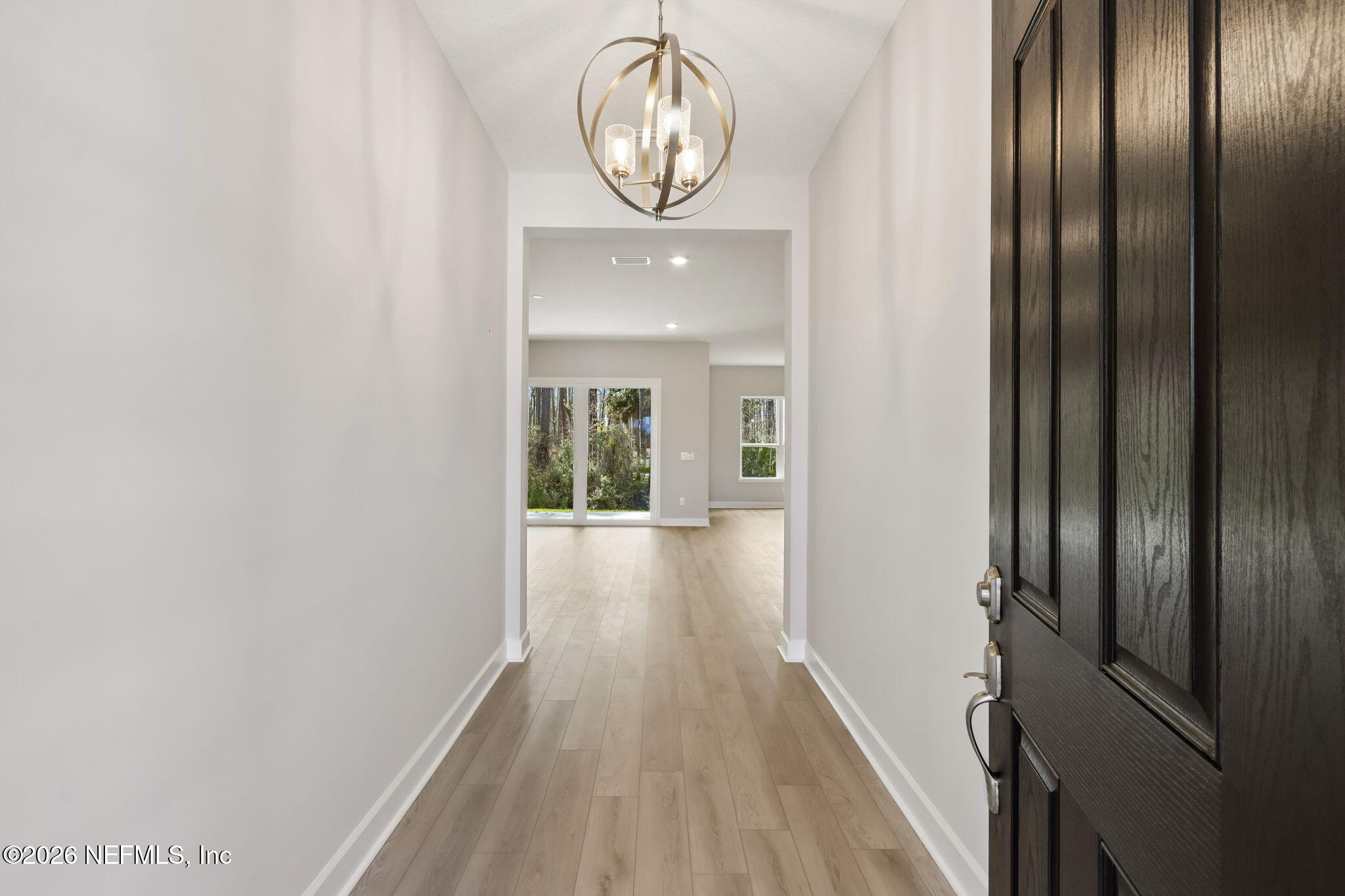 85350 Sandy Rdg Loop, Unit 39 Yulee, FL 32097 - Photo 4 of 29 a view of a hallway with wooden floor