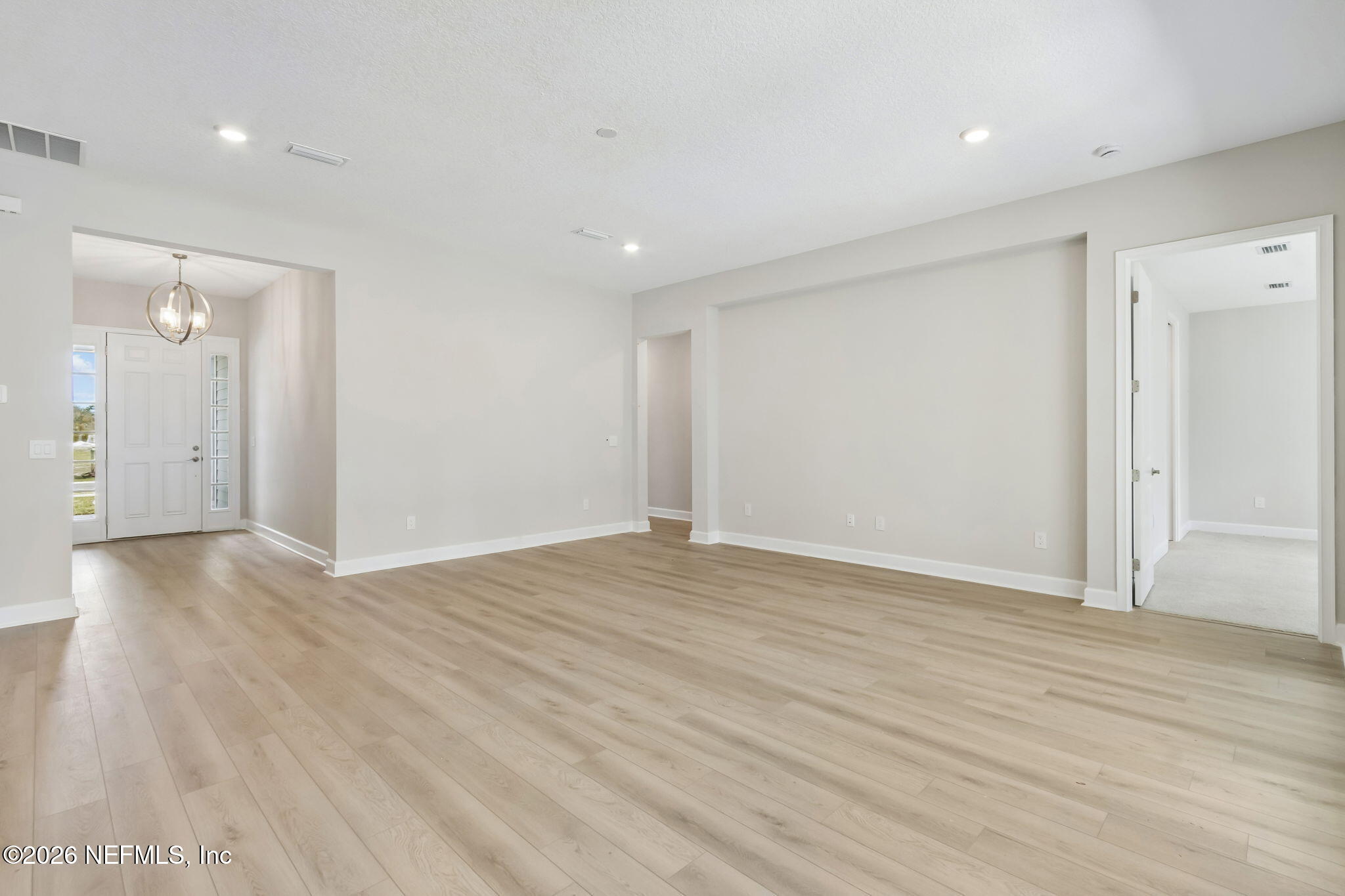 85350 Sandy Rdg Loop, Unit 39 Yulee, FL 32097 - Photo 6 of 29 a view of an empty room with wooden floor