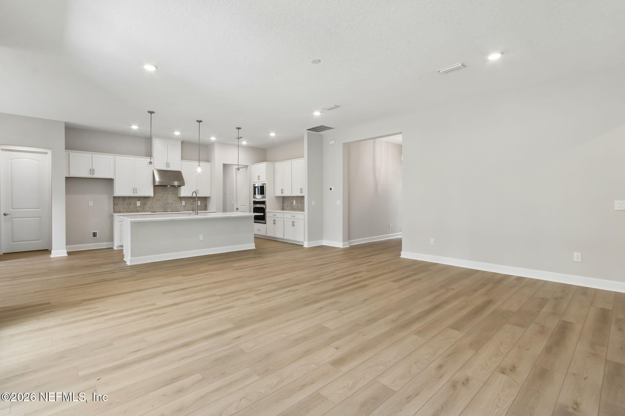 85350 Sandy Rdg Loop, Unit 39 Yulee, FL 32097 - Photo 7 of 29 a view of kitchen with wooden floor