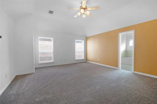 a view of empty room with windows